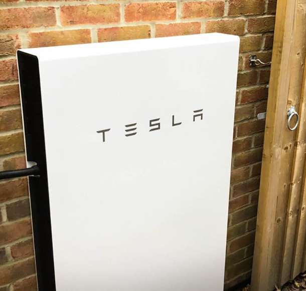 Close-up of the Tesla Powerpack installed on the side of a building